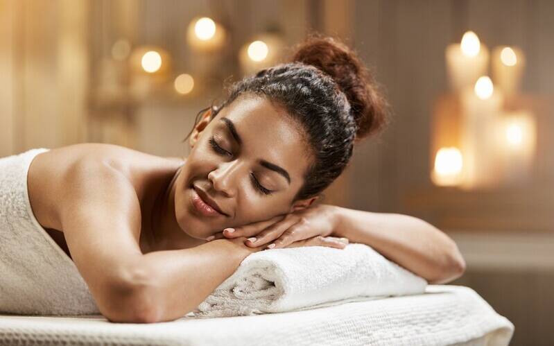 beautiful-african-woman-resting-relaxing-spa-resort-with-closed-eyes_176420-13951